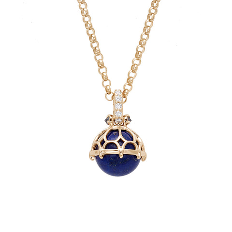 A one of a kind lapis pendant with white diamond pave on the top and grey diamond accent stones on either side on a yellow gold chain.