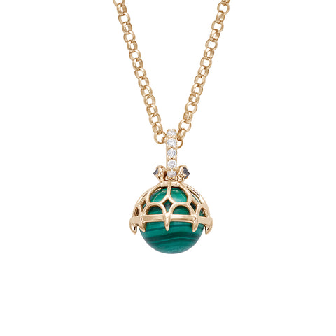 A one of a kind malachite pendant with white diamond pave on the top and grey diamond accent stones on either side on a yellow gold chain.