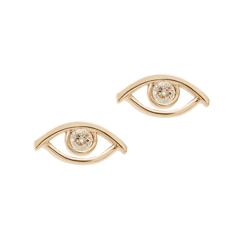 A pair of evil eye studs with a champagne diamond accent stone set in yellow gold.