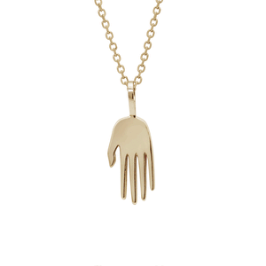 A small 14k yellow gold hand charm hanging from a gold chain. The video adds a white diamond to the center of the hand charm. And then adds a black diamond charm set in bezel to the right and a gothic letter charm with the letter "h" to the left.