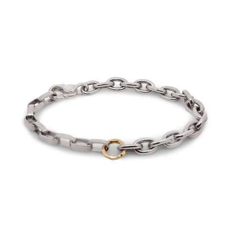 Silver chain bracelet with a gold clasp on a white background