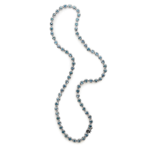 A swirled line necklace with Montana sapphires set in eternity in white gold.