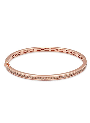 A bracelet with a line of champagne diamonds set around the band set in rose gold.
