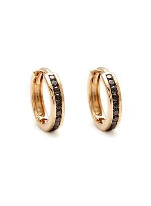 A pair of hoops with a line of black diamonds set in yellow gold.