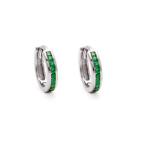 A pair of hoops with a line of green emeralds set in sterling silver.