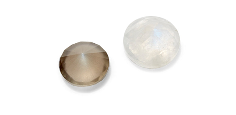 2 Moonstones on a flat surface and white background