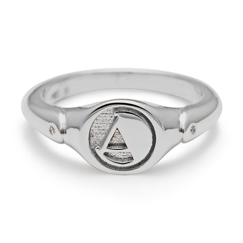 A monogrammed signet ring with an "A" on the front and two grey diamond accents on either side and set in sterling silver., Letter A