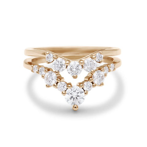 Two white diamond nesting bands set in yellow gold.