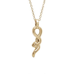 A medium 14k yellow gold serpent charm hanging from a gold chain. The video adds a white diamond charm set in bezel to the right and a gothic letter charm with the letter "g" to the left.
