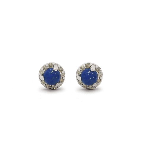 Pair of silver earrings with blue lapis lazuli gemstones encircled with tiny champagne diamonds on a white 