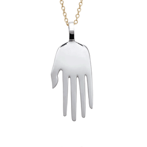 A large sterling silver hand charm hanging from a gold chain. The video adds white diamonds to the nails of the hand charm. And then adds a ruby charm set in bezel to the right and a gothic letter charm with the letter "n" to the left.