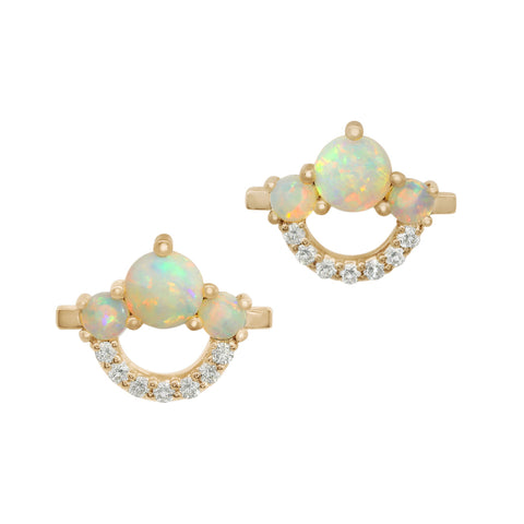 A pair of gold stud earrings featuring round opal beads and round white diamonds on a white background