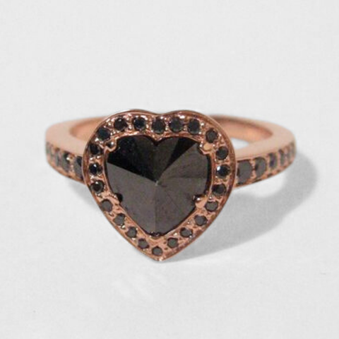 Heart cut black diamond solitare ring featuring black diamond melee set in rose gold. 