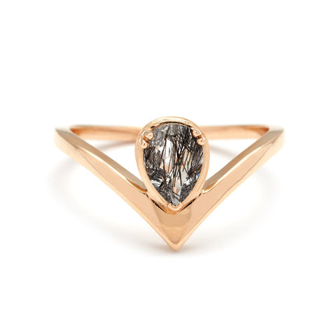 A pear shaped ring with a black rutilated quartz center stone set in yellow gold., Yellow Gold