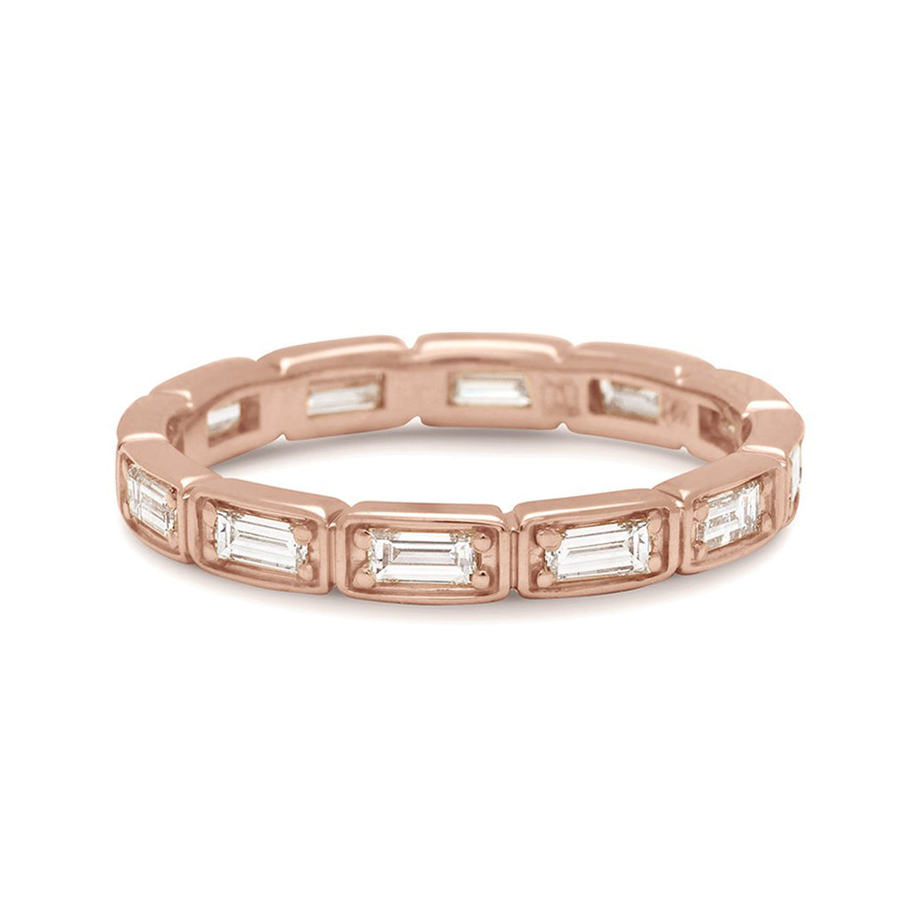 A white diamond baguette band that has diamond goes all around the band set in rose gold., Rose Gold