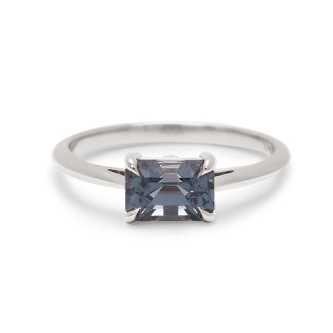 An east/west solitaire ring with an emerald shape grey spinel stone set in white gold., White Gold 4