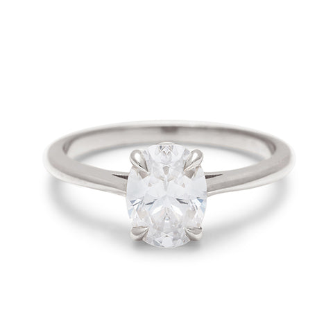 A solitaire brilliant cut oval 1.00ct white diamond set in white gold., White Gold 4