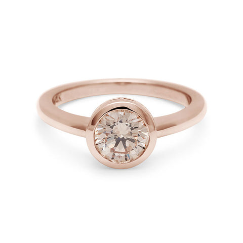 A round brilliant cut bezel set champagne diamond set in rose gold., Rose Gold