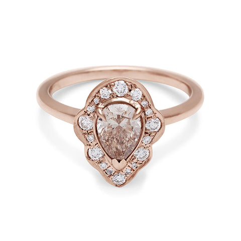 A pear shaped champagne diamond ring set in a halo of white diamonds and in rose gold., Rose Gold 2