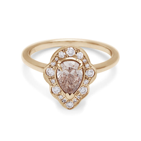 A pear shaped champagne diamond ring set in a halo of white diamonds and in yellow gold., Yellow Gold