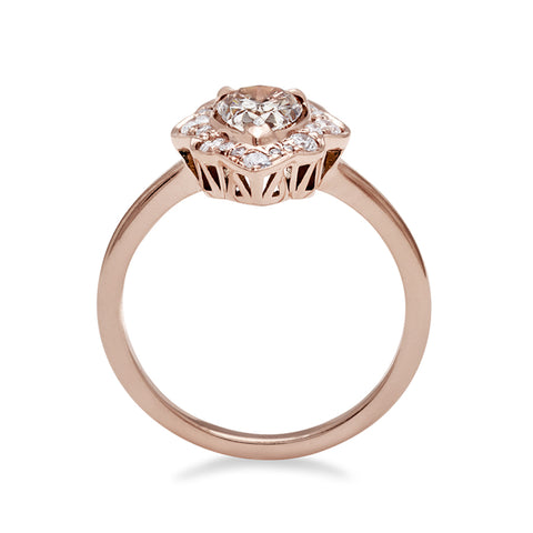 A side view of a pear shaped champagne diamond ring set in a halo of white diamonds and in rose gold., Rose Gold, Yellow Gold 3