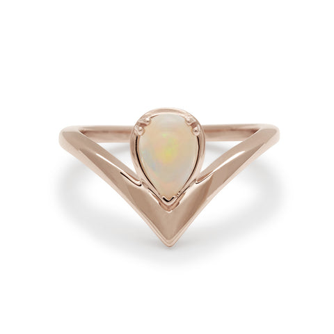 A pear shaped ring with an opal center stone set in rose gold., Rose Gold 4