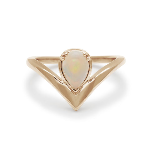 A pear shaped ring with an opal center stone set in yellow gold., Yellow Gold