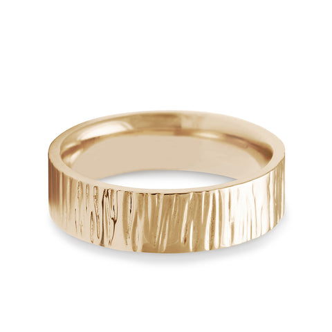 A comfort fit solid gold band with birch engraving on the outside set in yellow gold., Yellow Gold 2