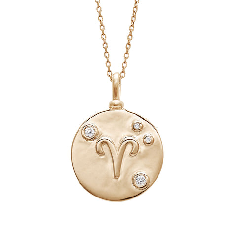 A 18mm charm with the Aires zodiac sign set in yellow gold with white diamond accent stones on a yellow gold chain.