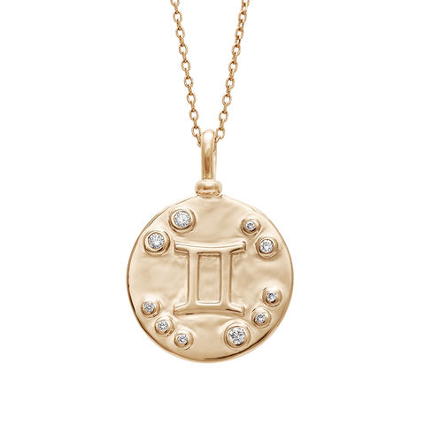 A 18mm charm with the Gemini zodiac sign set in yellow gold with white diamond stones on a yellow gold chain.