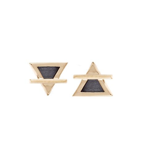 A pair of triangle studs with black rhodium representing the earth and air elements set in yellow gold.
