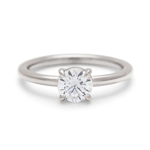 A solitaire round 0.75ct white diamond ring with claw prongs set in white gold., White Gold 11