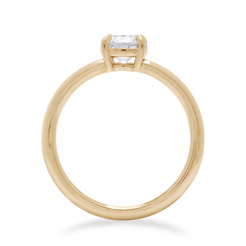 Side view of a solitaire round 0.75ct white diamond ring with claw prongs set in yellow gold., Yellow Gold 9