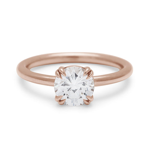 A solitaire round 1.25ct white diamond ring with double claw prongs set in rose gold., Rose Gold 16