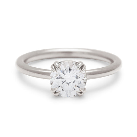 A solitaire round 1.25ct white diamond ring with double claw prongs set in white gold., White Gold 17