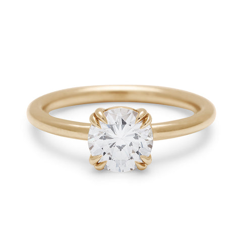 A solitaire round 1.25ct white diamond ring with double claw prongs set in yellow gold., Yellow Gold 15