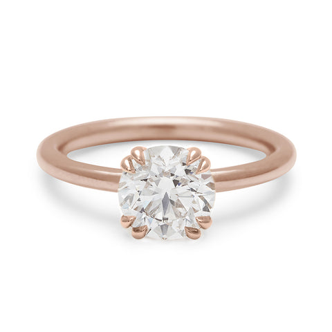 A solitaire round brilliant cut 1.50ct white diamond ring with double claw prongs set in rose gold., Rose Gold 6