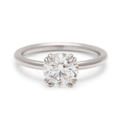 A solitaire round brilliant cut 1.50ct white diamond ring with double claw prongs set in white gold., White Gold 5