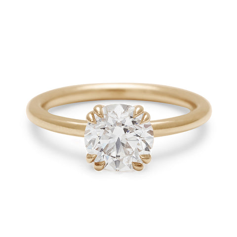 A solitaire round brilliant cut 1.50ct white diamond ring with double claw prongs set in yellow gold., Yellow Gold