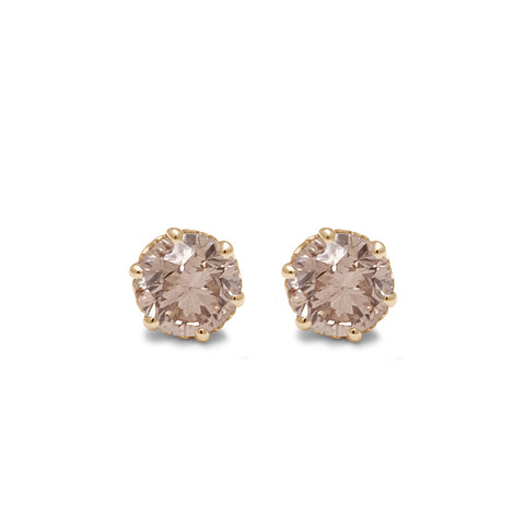 A pair of champagne diamond stud earrings set in an intricate basket in yellow gold.