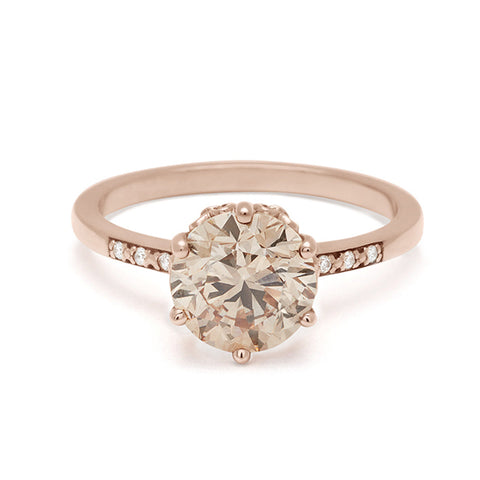 A solitaire ring with a round 2.00ct champagne diamond with white diamond pave on either side set in rose gold., Rose Gold 15