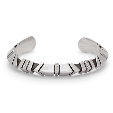 A sterling silver cuff with definition and white diamond accent stones.