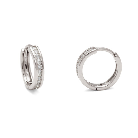 A pair of hoops with a line of white diamonds set in white gold one earring turned to the side., White Gold 7