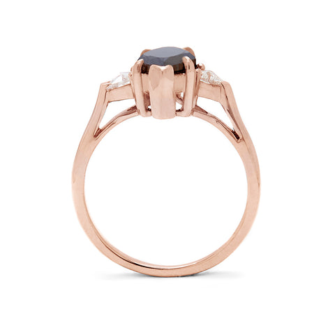 Side view of a three stone engagement ring with a marquise shape 1.25ct black diamond center stone with two white diamond trillion side stones set in rose gold., Rose Gold 3
