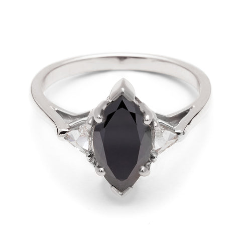 A three stone engagement ring with a marquise shape 1.25ct black diamond center stone with two white diamond trillion side stones set in white gold., White Gold 4