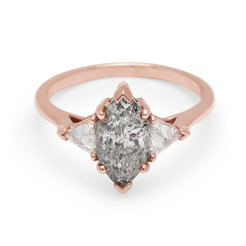 A three stone engagement ring with a marquise shape 1.50ct grey diamond center stone with two white diamond trillion side stones set in rose gold., Rose Gold