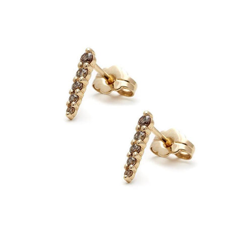 A pair of five champagne diamond pointe earring studs set in yellow gold.