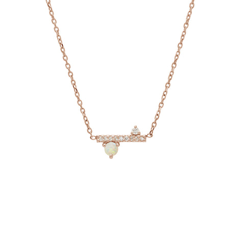 A straight line of white diamond pave with a opal accent stone on one side set in a rose gold necklace chain., Rose Gold 2