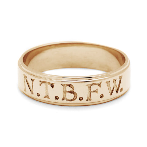 A yellow gold 6mm flat edge band with "N.T.B.F.W." engraved on the outside., Yellow Gold 2