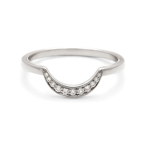 A curved crescent shaped band with 11 white diamonds set in white gold.
